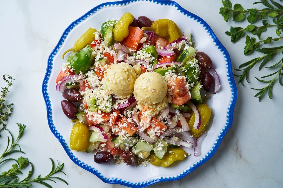 Fresh Greek salad with feta cheese and kalamata olives, a healthy lunch option at Little Greek Fresh Grill Winter Garden FL