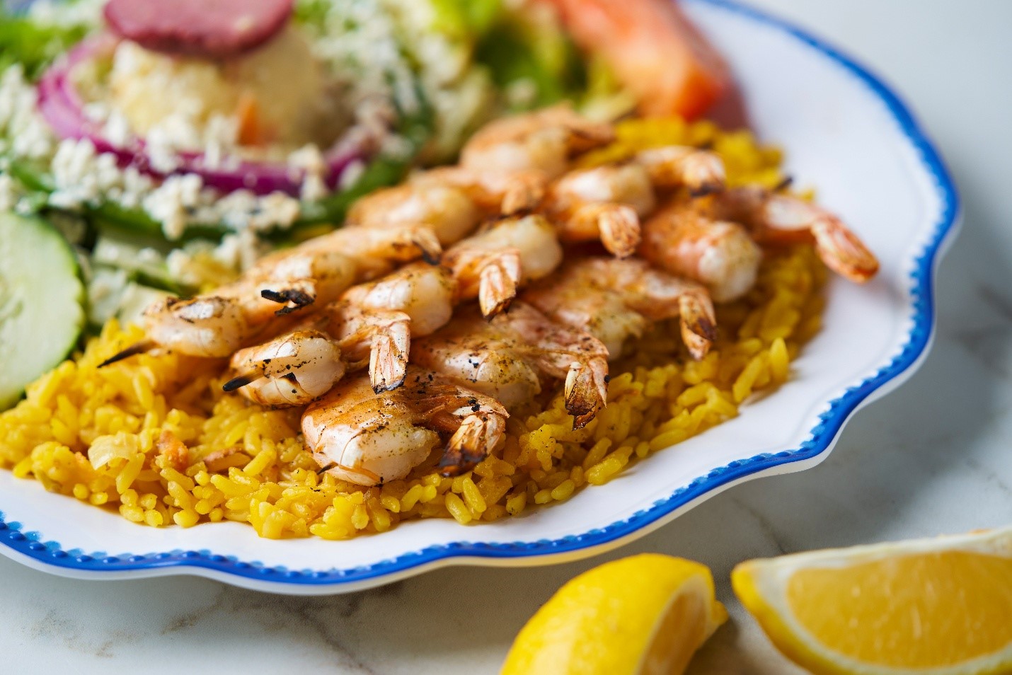 Shrimp souvlaki with rice and Greek salad, the healthiest fast casual meal near Winter Garden Village FL