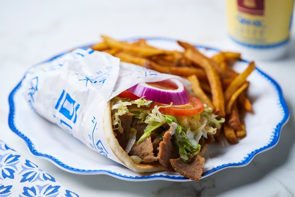 Gyro pita with gyro meat, tzatziki sauce and fresh vegetables at Little Greek Fresh Grill Winter Garden FL