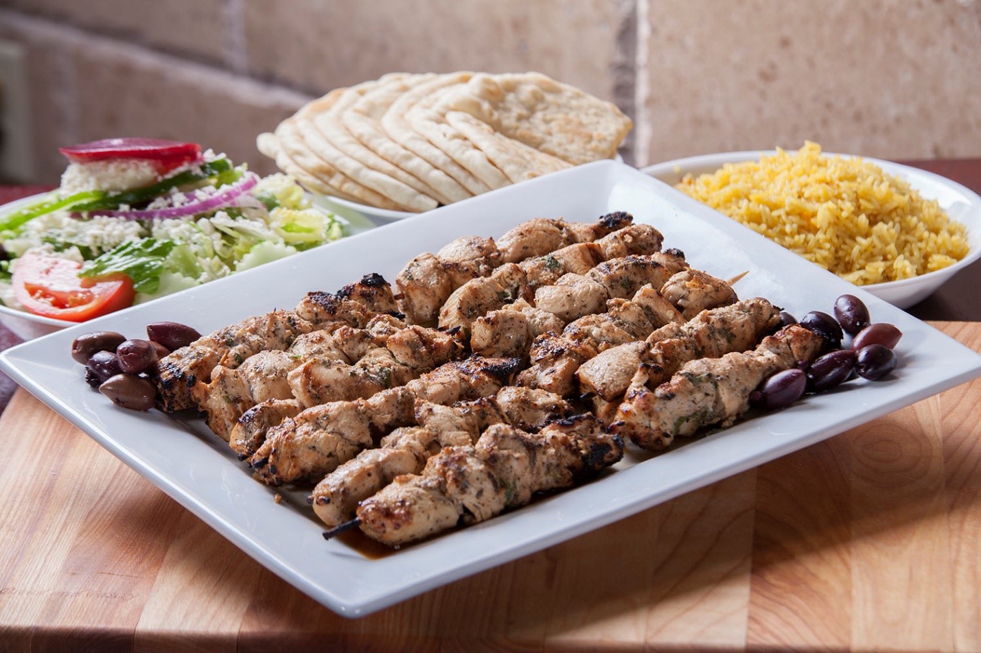 Char-grilled chicken souvlaki skewers close-up at Little Greek Fresh Grill Winter Garden FL high protein Greek food